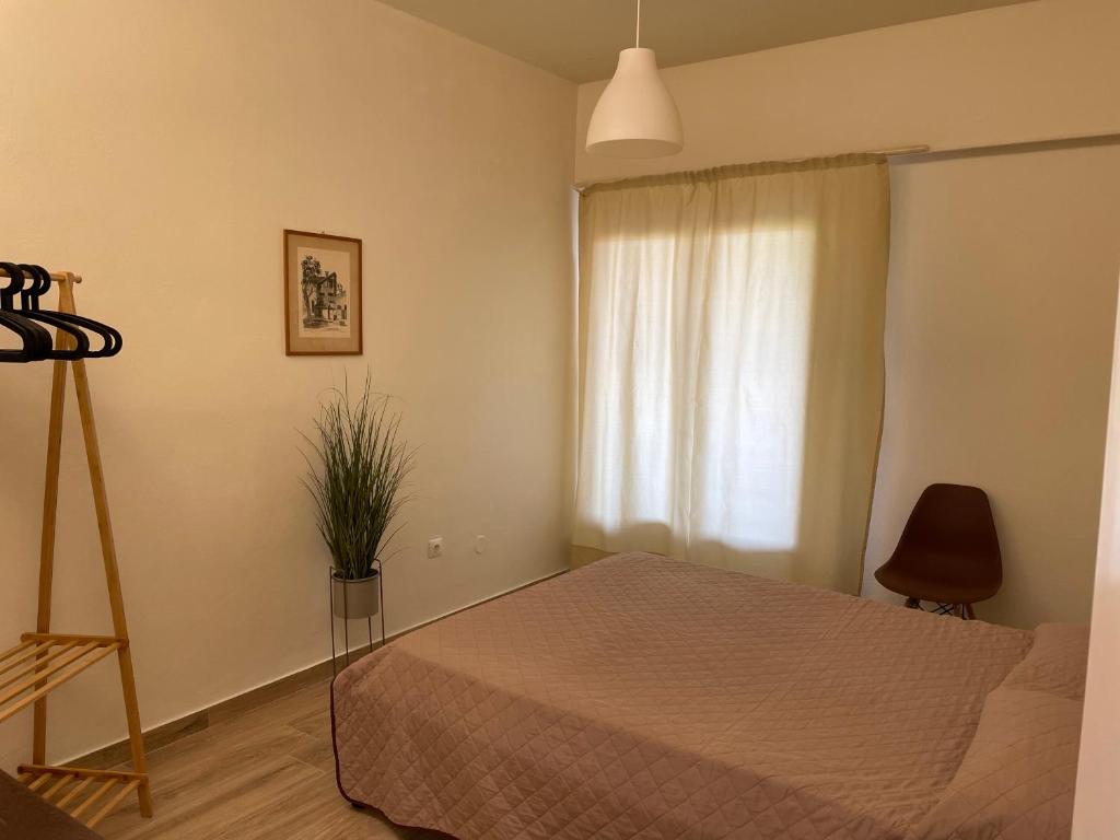 A bed or beds in a room at Kontos Mansion