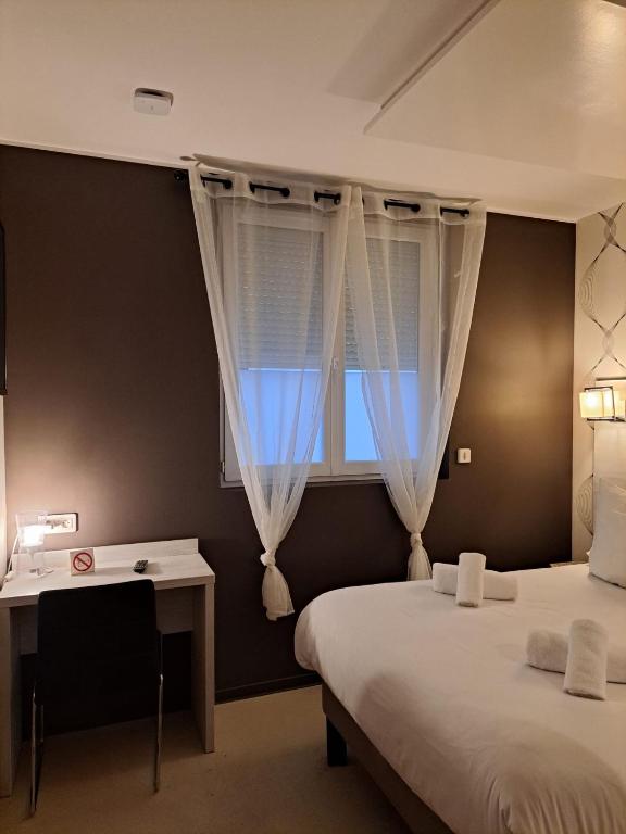 Postel nebo postele na pokoji v ubytování LE PATIO