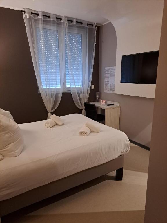 Postel nebo postele na pokoji v ubytování LE PATIO