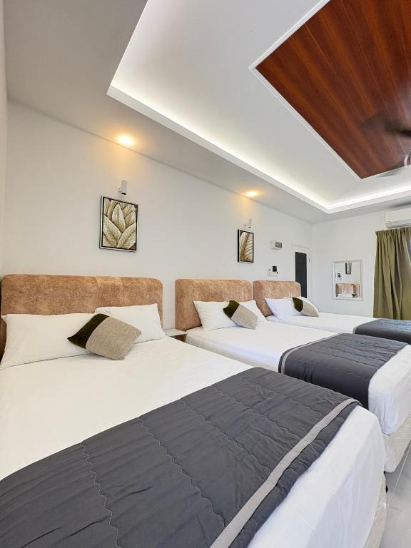Postel nebo postele na pokoji v ubytování Eleven25 Roomstay