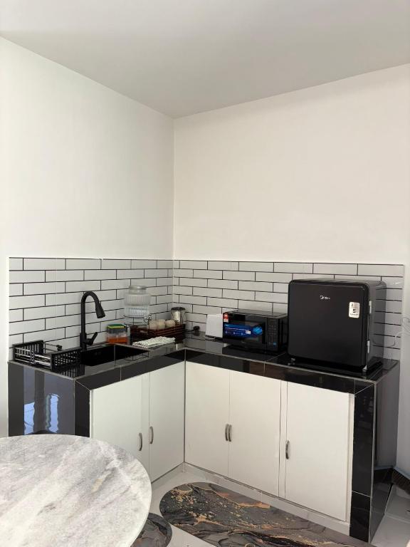 Kuchyň nebo kuchyňský kout v ubytování Eleven25 Roomstay