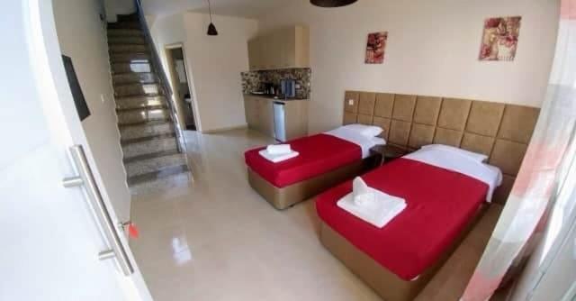 Ένα ή περισσότερα κρεβάτια σε δωμάτιο στο Emilia apartments