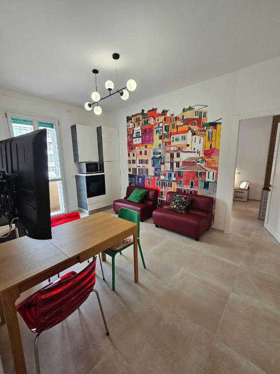 a living room with a large painting on the wall at Da Camilla in Cagliari