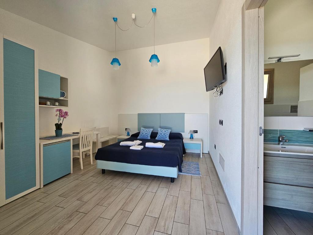 TV a/nebo společenská místnost v ubytování Hotel Pranos Turismo Rurale Cala Gonone
