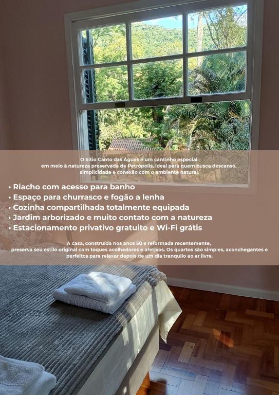 a poster of a window with a bed in a room at Sítio Canto das Águas in Petrópolis