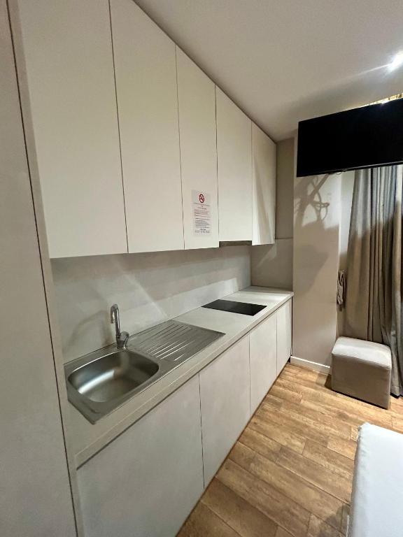 Kuchyň nebo kuchyňský kout v ubytování Guza Apartments