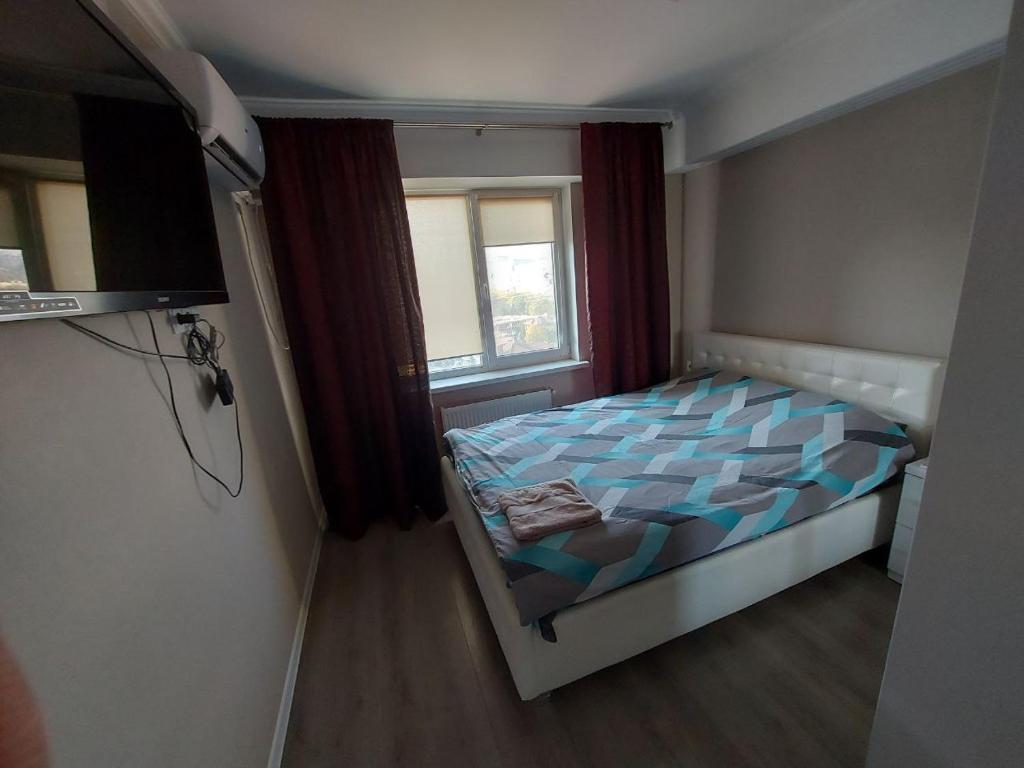 Postel nebo postele na pokoji v ubytování Уютная квартира в центре города