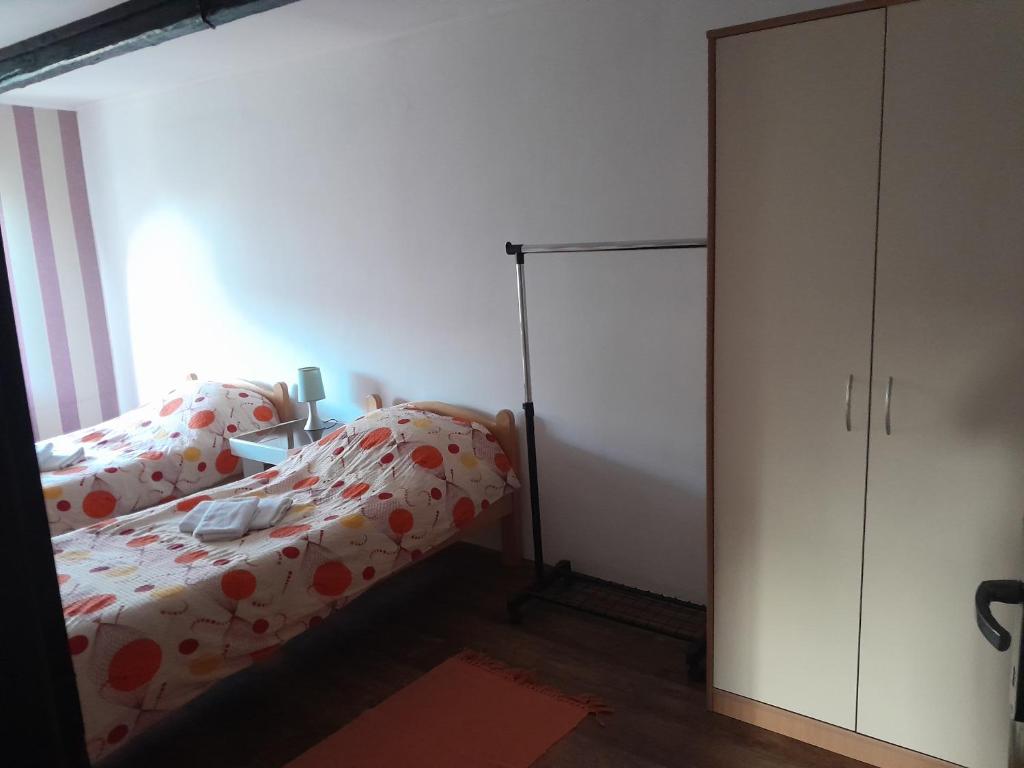 Postel nebo postele na pokoji v ubytování Apartman Sanika