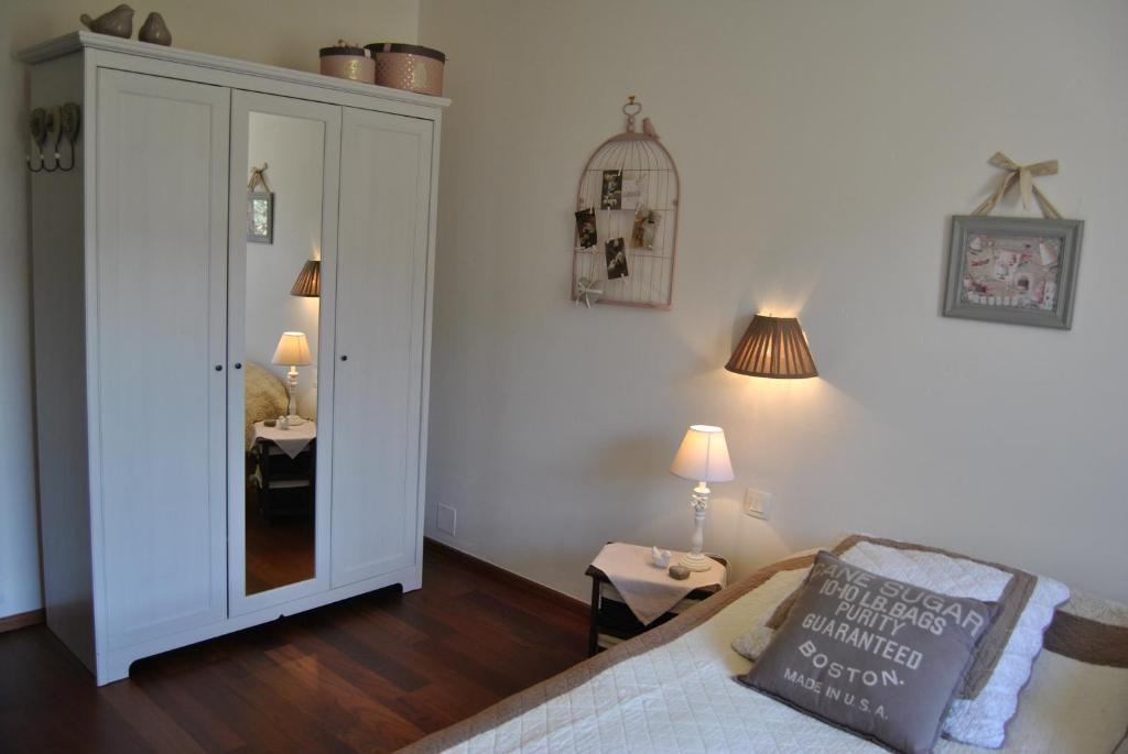 Postel nebo postele na pokoji v ubytování Appartements & Chambres Les Loges du Capucin
