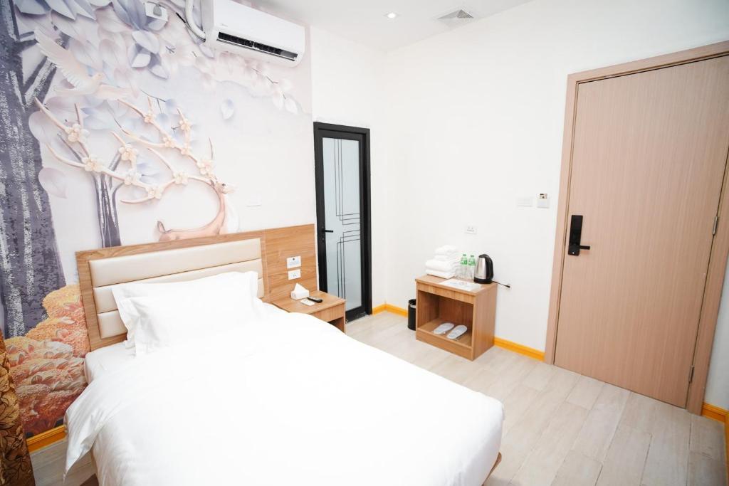 Postel nebo postele na pokoji v ubytování Home me Hotel