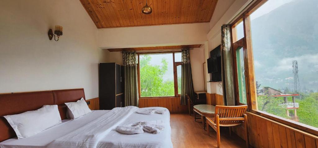 Postel nebo postele na pokoji v ubytování Hostelam The Mountain Story