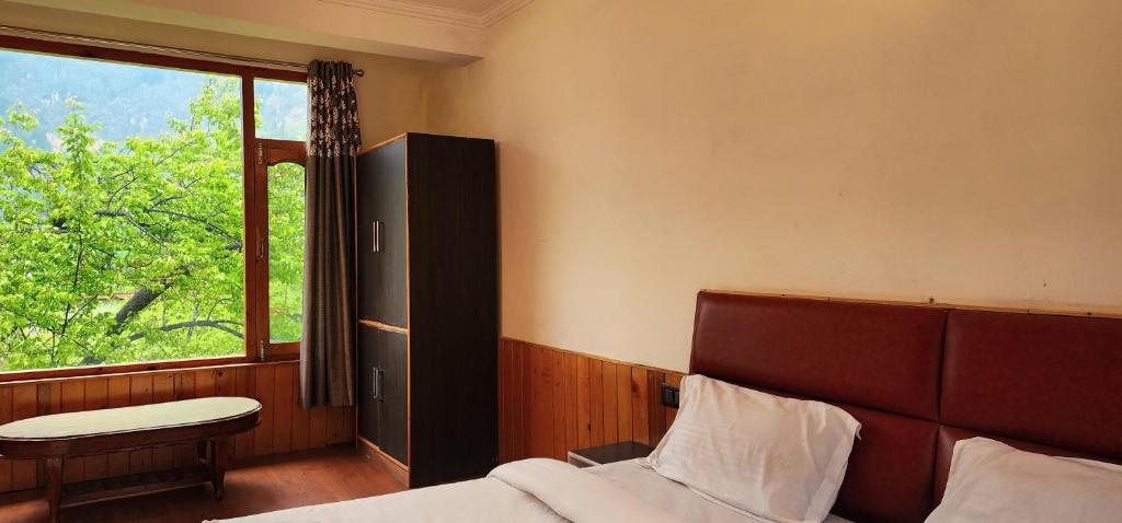 Postel nebo postele na pokoji v ubytování Hostelam The Mountain Story