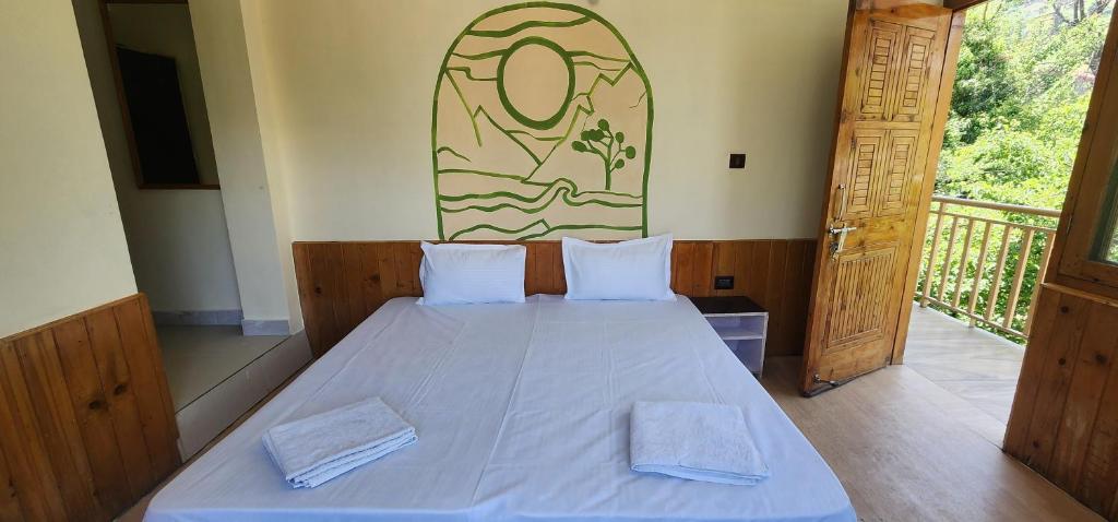 Postel nebo postele na pokoji v ubytování Hostelam The Mountain Story