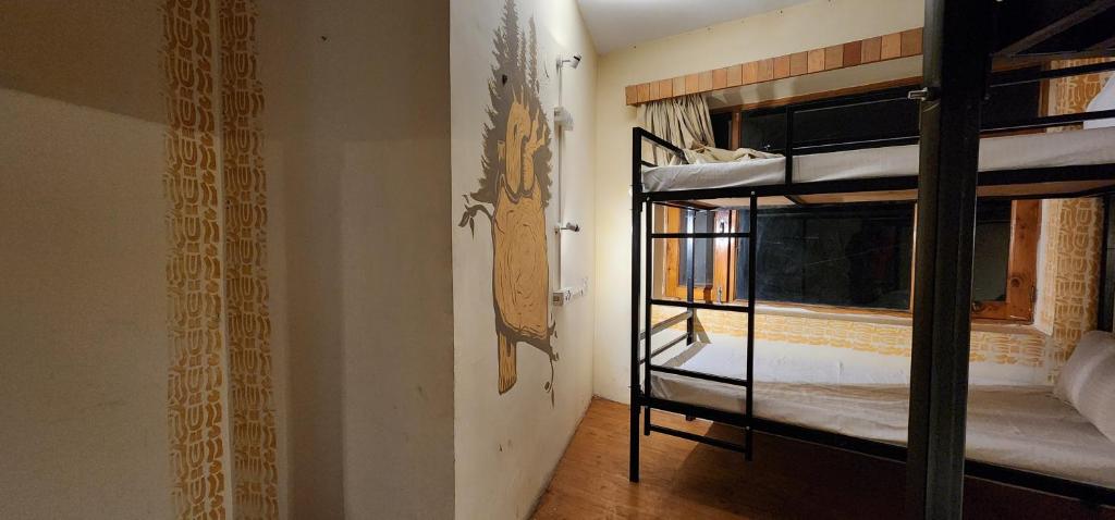 Postel nebo postele na pokoji v ubytování Hostelam The Mountain Story