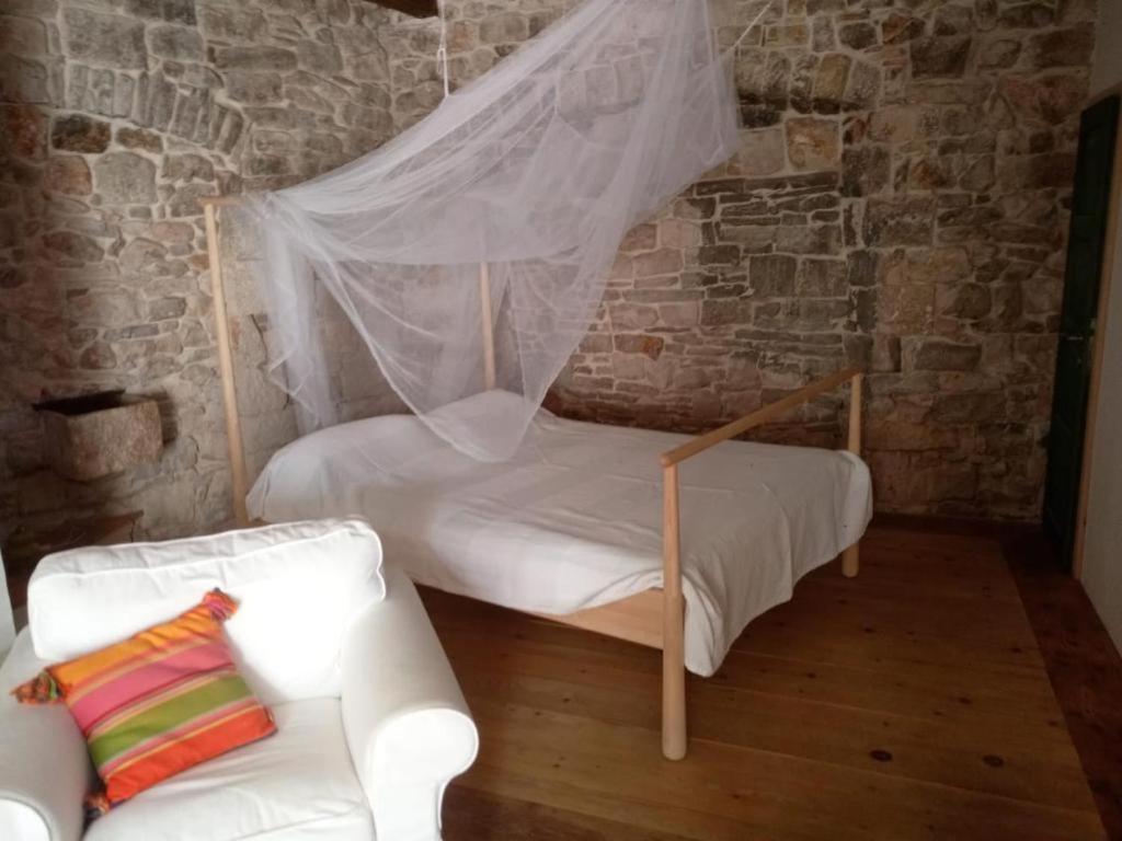 Postel nebo postele na pokoji v ubytování La Belle et la Bête