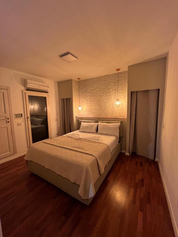 a bedroom with a large bed with two pillows at Lo Zaffiro in Gioia del Colle