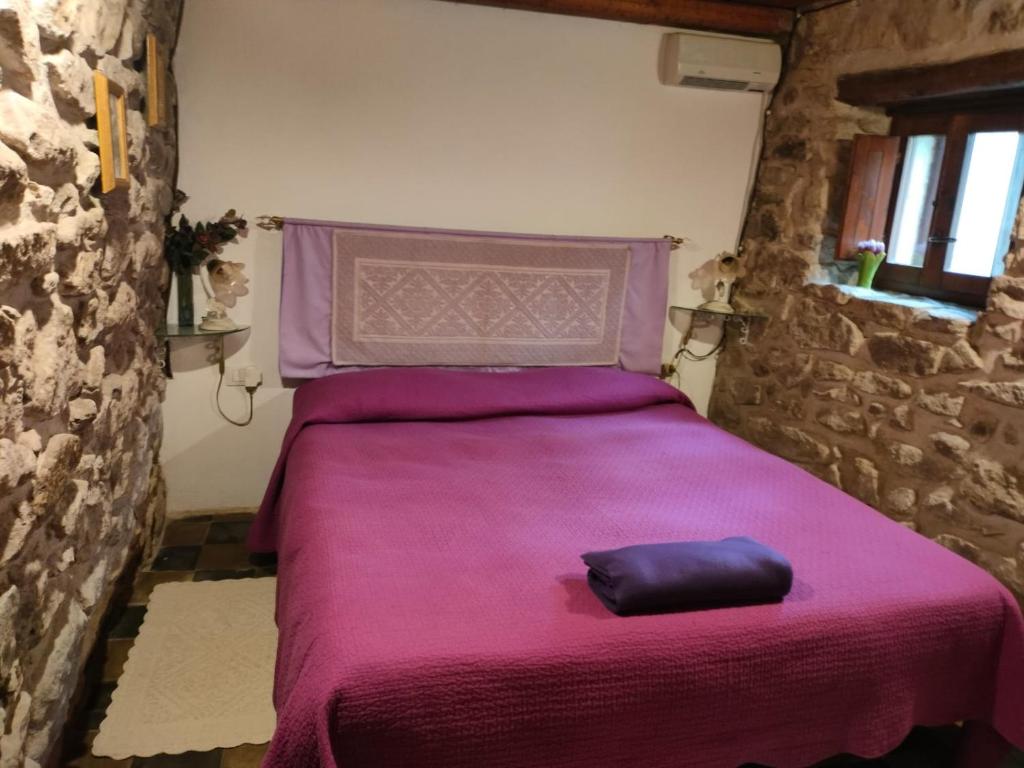 Postel nebo postele na pokoji v ubytování Casa di Pietra