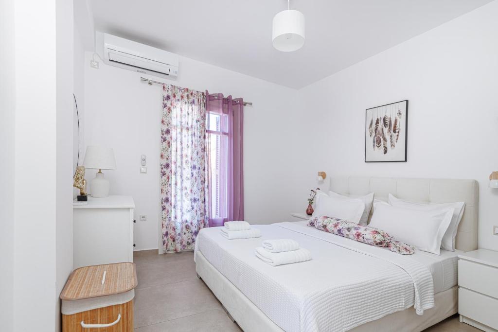 Postel nebo postele na pokoji v ubytování Aster Apartments
