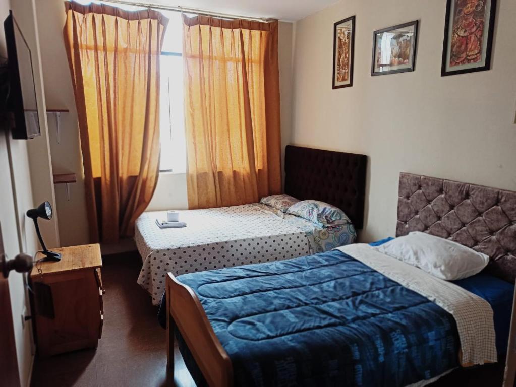 Postel nebo postele na pokoji v ubytování Hospedaje Wankko