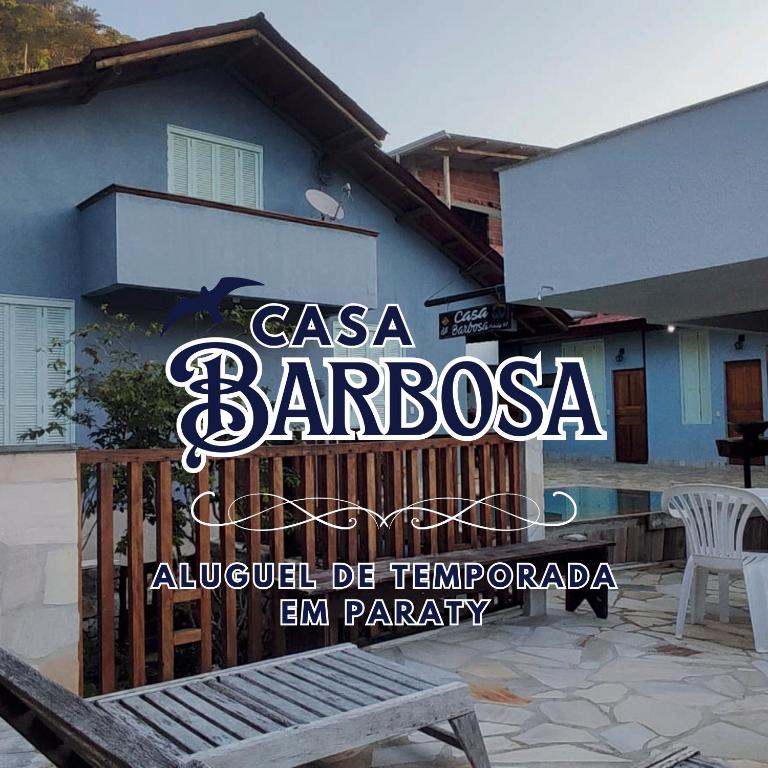 a sign on the side of a building at Casa Barbosa Paraty in Paraty