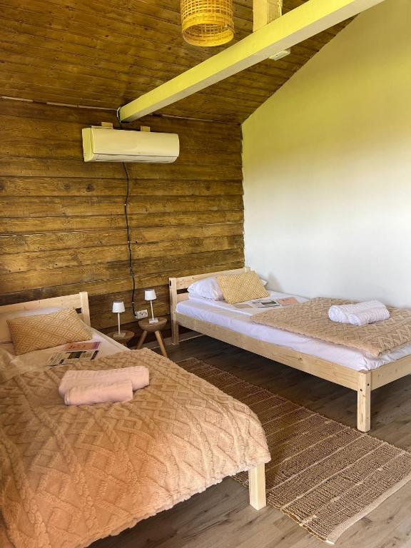 Postel nebo postele na pokoji v ubytování Serenity Retreats Maciuca