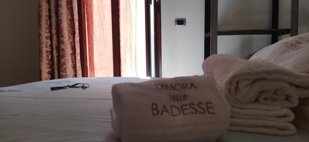 Postel nebo postele na pokoji v ubytování Dimora delle Badesse