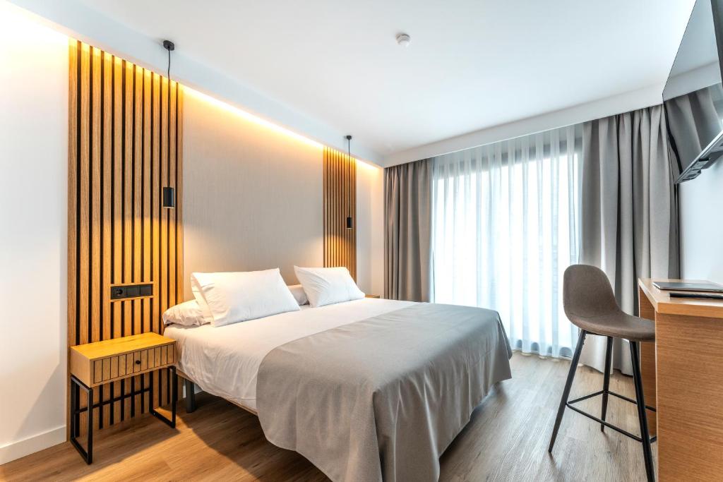 Ένα ή περισσότερα κρεβάτια σε δωμάτιο στο Centrotel Zamora