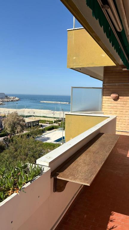 a view of the beach from the balcony of a house at Adriatico 98 in Fano
