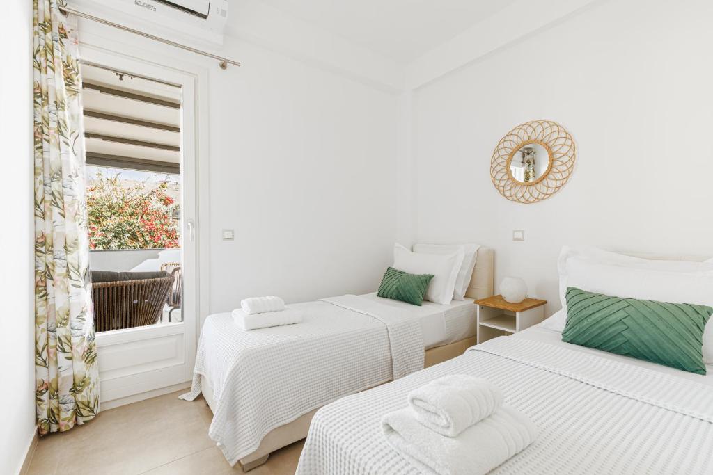 Postel nebo postele na pokoji v ubytování Aster Apartments