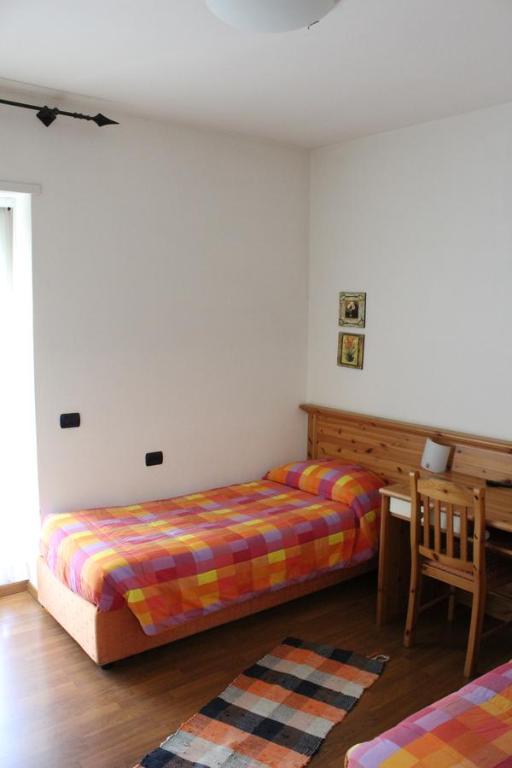 Postel nebo postele na pokoji v ubytování Hotel Culmine