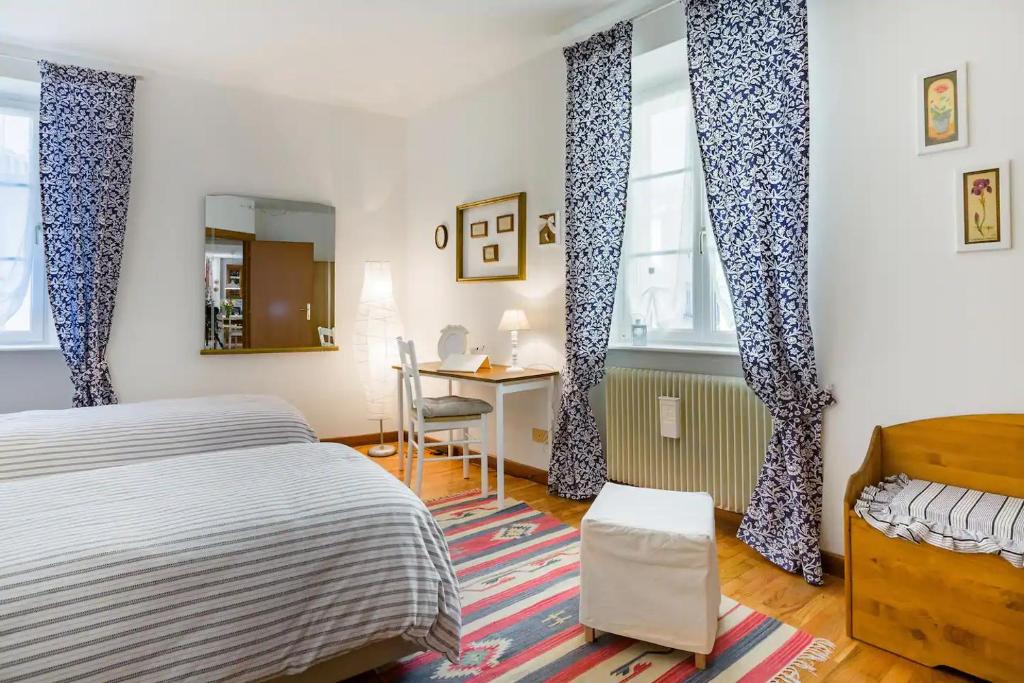 Postel nebo postele na pokoji v ubytování TRENTINO LODGE Via San Vito