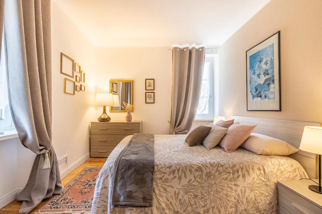Postel nebo postele na pokoji v ubytování TRENTINO LODGE Via San Vito