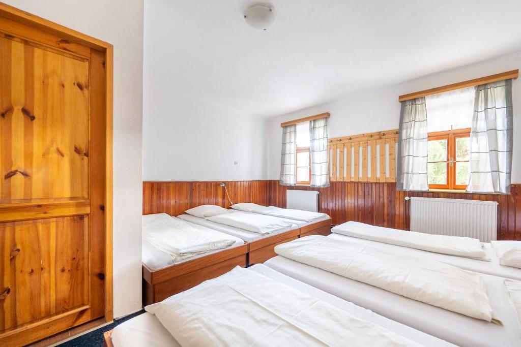Postel nebo postele na pokoji v ubytování Chata Čert