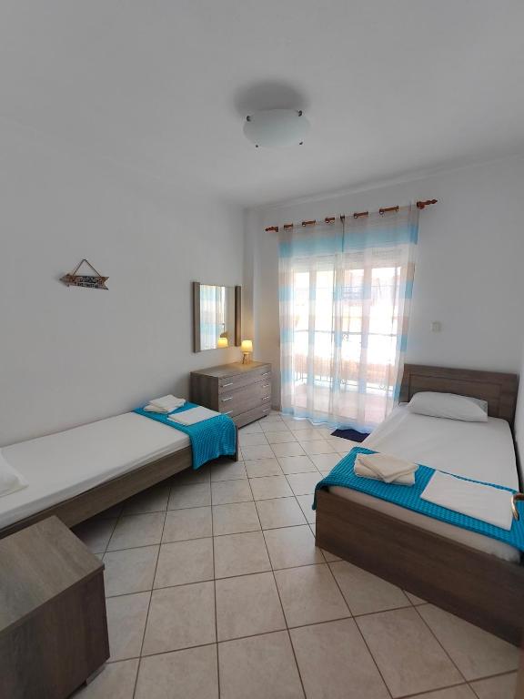 Posteľ alebo postele v izbe v ubytovaní Roses RT apartments Skioni II