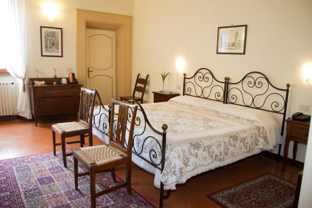 Postel nebo postele na pokoji v ubytování B&B L'Agnolo Di Caroti Cinzia
