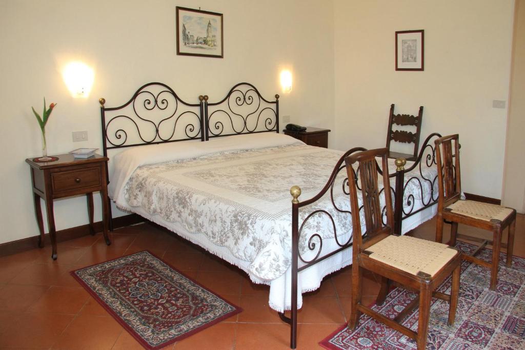 Postel nebo postele na pokoji v ubytování B&B L'Agnolo Di Caroti Cinzia