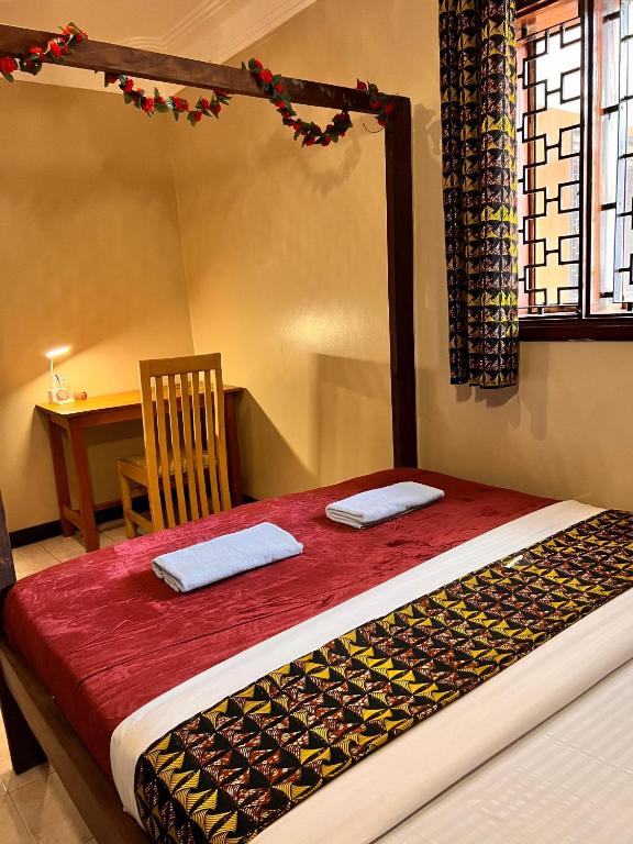 Postel nebo postele na pokoji v ubytování Ubuntu Hivve Hostel
