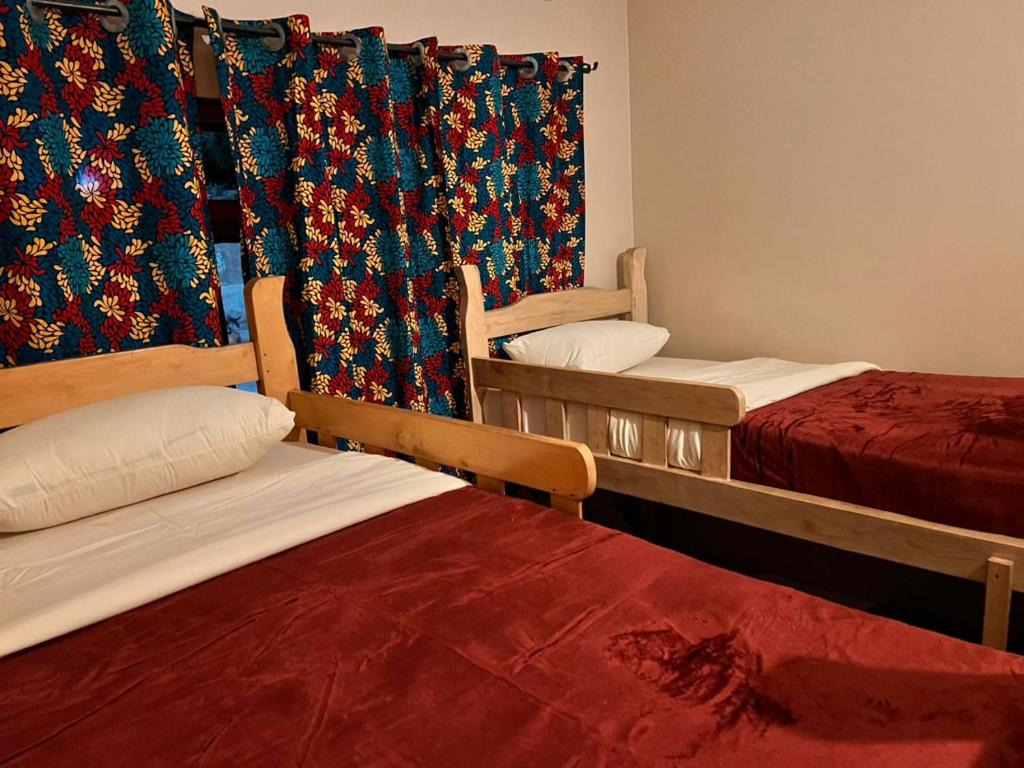 Postel nebo postele na pokoji v ubytování Ubuntu Hivve Hostel