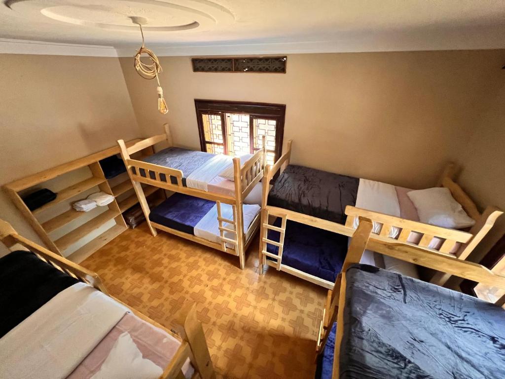 Postel nebo postele na pokoji v ubytování Ubuntu Hivve Hostel