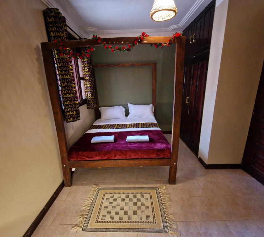 Postel nebo postele na pokoji v ubytování Ubuntu Hivve Hostel