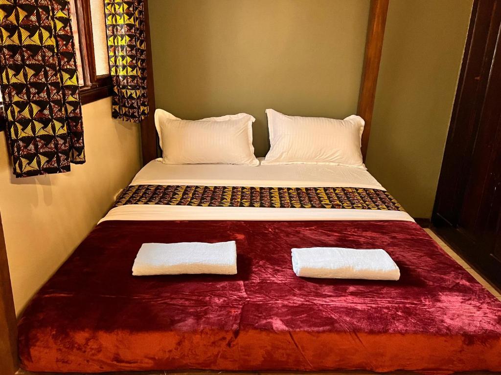 Postel nebo postele na pokoji v ubytování Ubuntu Hivve Hostel