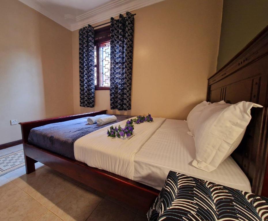 Postel nebo postele na pokoji v ubytování Ubuntu Hivve Hostel