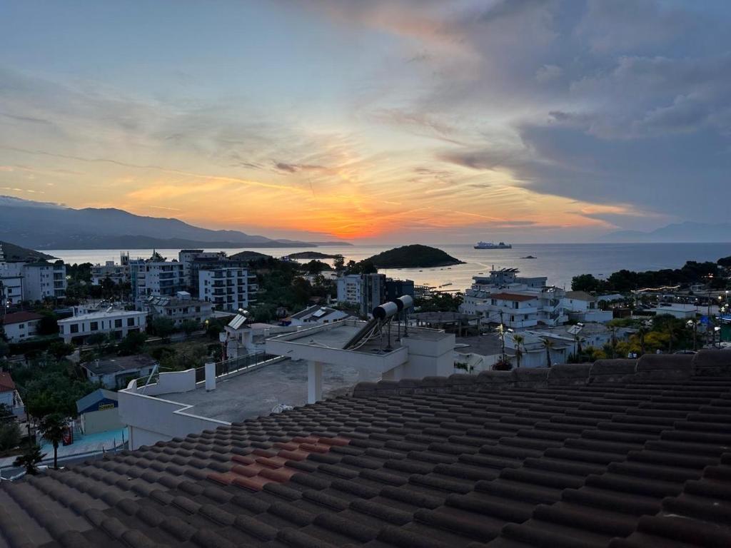 a view of the sunset from the roof of a building at Hotel Marku in Ksamil