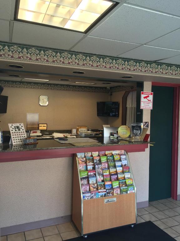 a food counter in a restaurant with avertisement at Express INN in Norfolk
