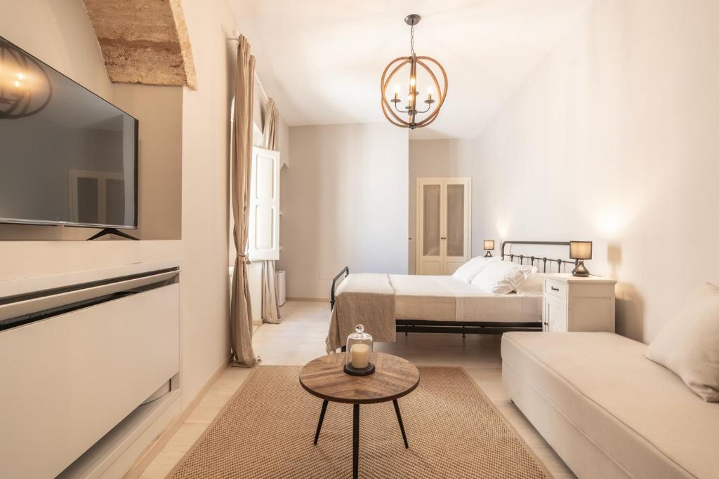 A bed or beds in a room at Don Alfonso Dimora D'epoca