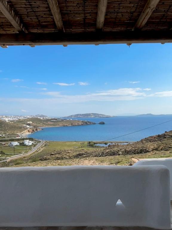 a view of a body of water from a window at Blue and White Mykonos ap2 in Mikonos