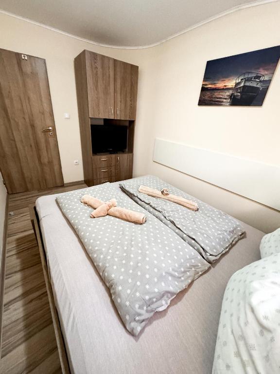 Postel nebo postele na pokoji v ubytování KK Apartment