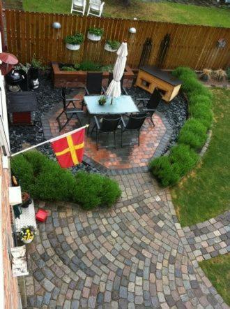 an aerial view of a patio with a table and a flag at Fingal 9 studio apartments in Landskrona