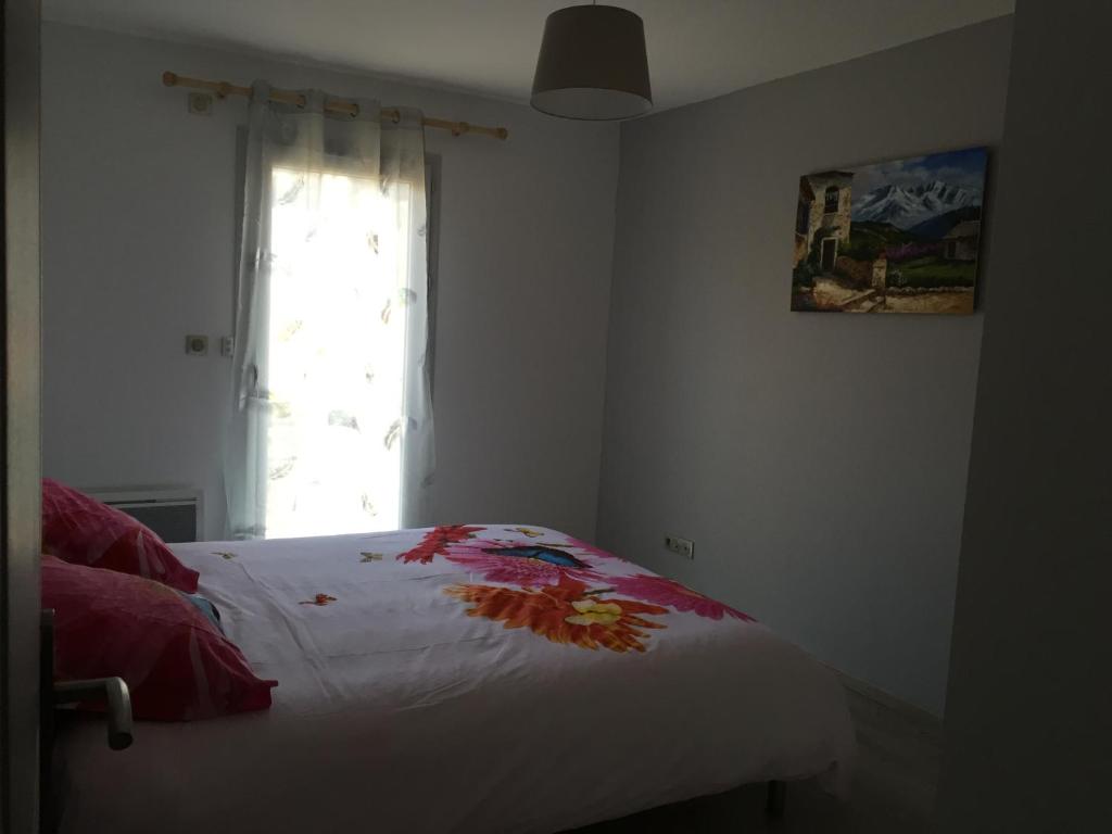 Cama o camas de una habitaci&oacute;n en Villa MARIA