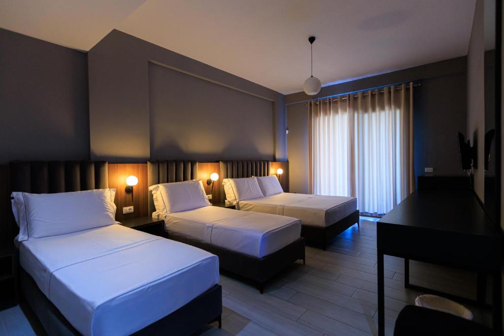 Postel nebo postele na pokoji v ubytování Hotel Amare